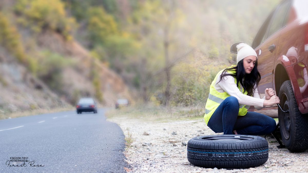 Girl changing tire - life skills to teach your children