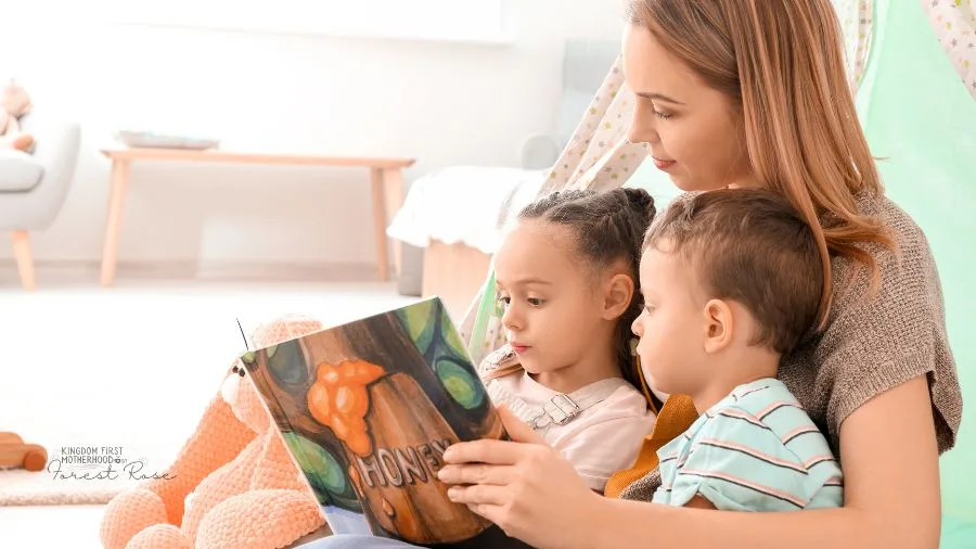 Mom reading a book to her kids