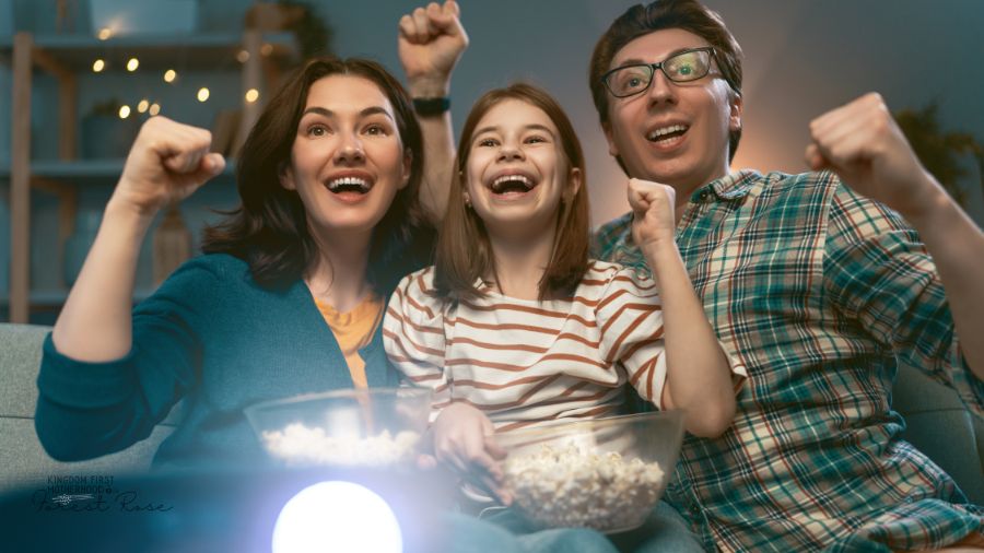 Family watching projector