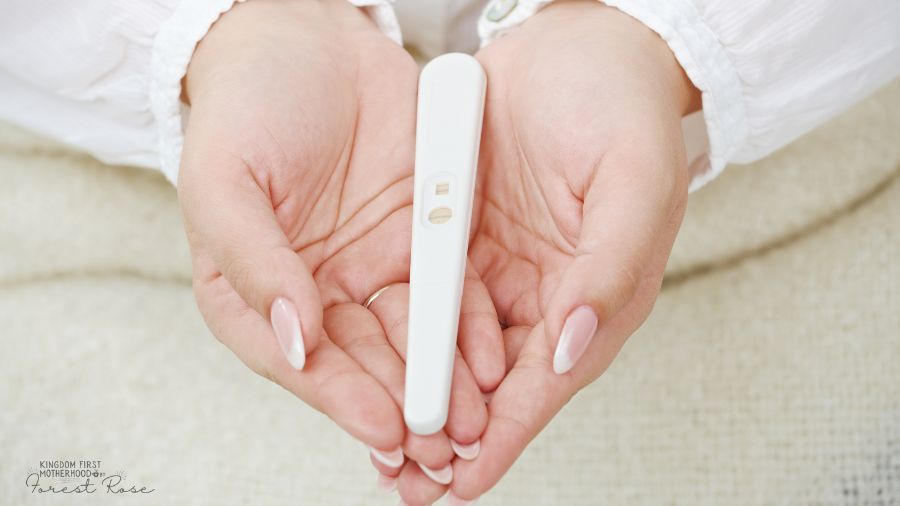 First-time mom holding a positive pregnancy test